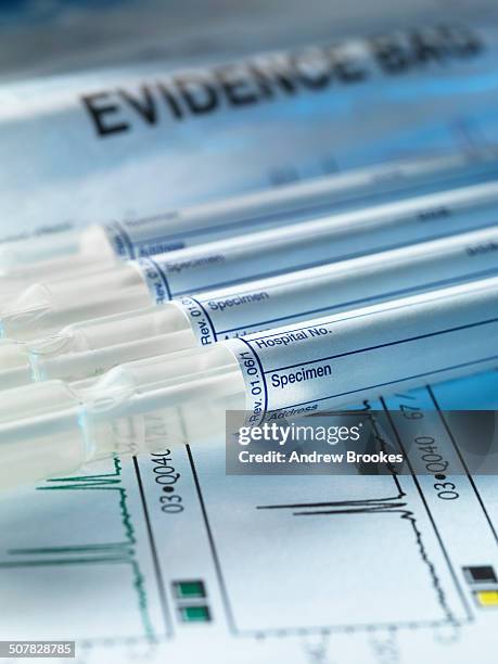 a row of samples from a crime scene on top of genetic testing results - future proof stock pictures, royalty-free photos & images