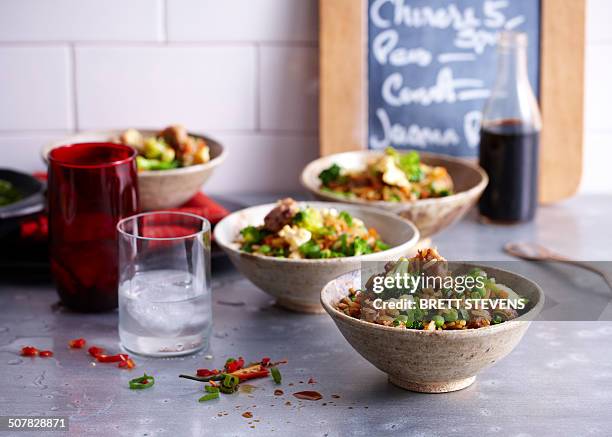 cafe counter with bowls of fried rice with sausage and egg - arbeitsplatte stock-fotos und bilder