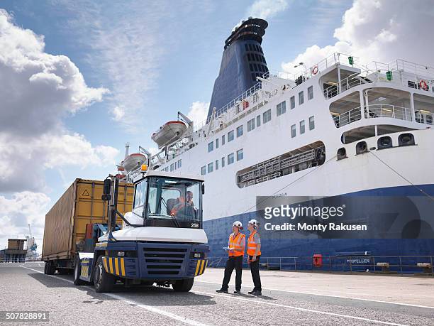 port workers on dock side beside ship - hull uk stock pictures, royalty-free photos & images