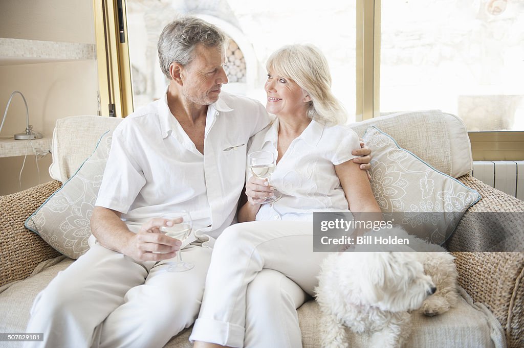 Couple celebrating in hotel room