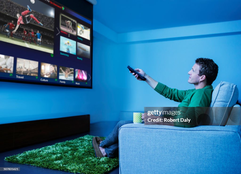 Man watching television in living room