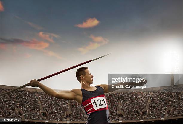 track and field athlete throwing javelin - lancer du javelot photos et images de collection