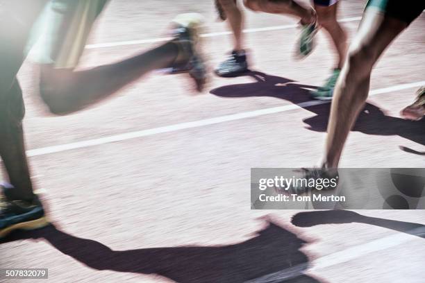 Runners racing on track