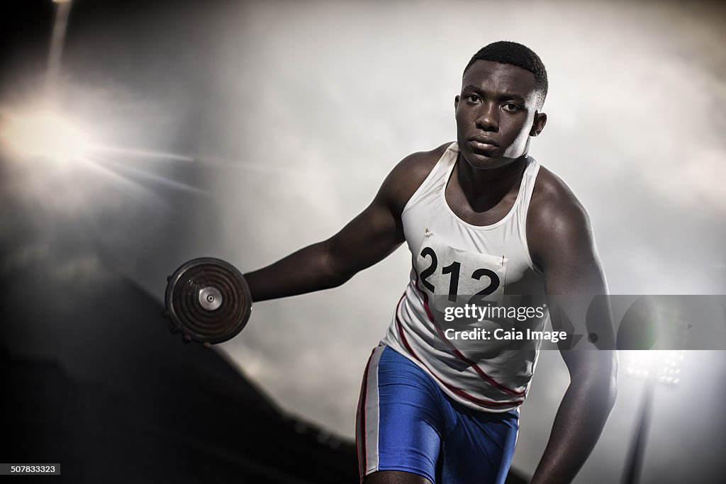 Track and field athlete holding discus