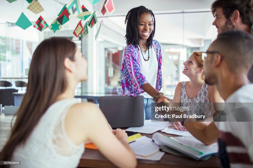 People shaking hands in meeting