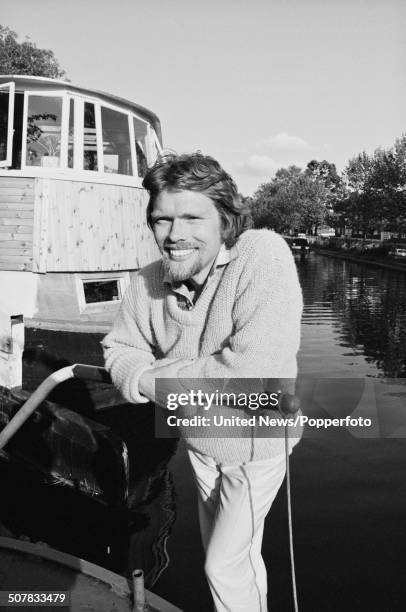 English businessman and owner of Virgin Records, Richard Branson posed on his houseboat on the Grand Union canal in London on 26th May 1982.