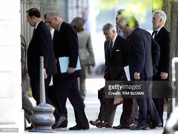 Members of the National Commission on Terrorist Attacks on the US, walk in the West Executive entrance to the West Wing of the White House for their...