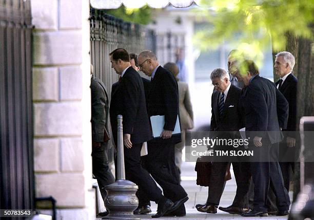 Members of the National Commission on Terrorist Attacks on the US, file into the West Executive entrance to the West Wing of the White House for...