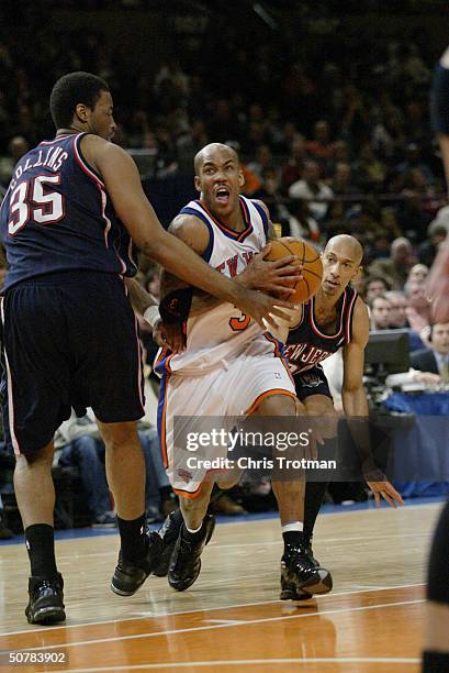 Stephon Marbury of the New York Knicks drives on Jason Collins of the New Jersey Nets during Game four of the Eastern Conference Quarterfinals during...