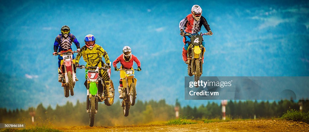 Motocross bikers in the air