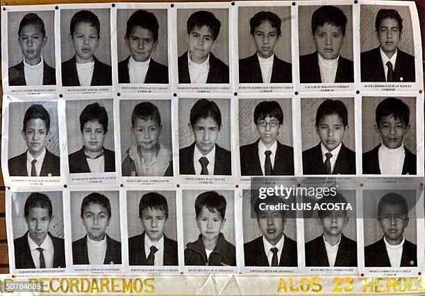 Esta foto tomada el 29 de abril de 2004 muestra las fotos conmemorativas de 21 de los 23 ninos del colegio Agustiniano que murieron cuando una...