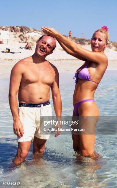 The French actress and singer Marlene Mourreau with the Spanisah actor Pepe Viyuela in the beech of Son Bou, 17th August 1998, Menorca, Balearic...