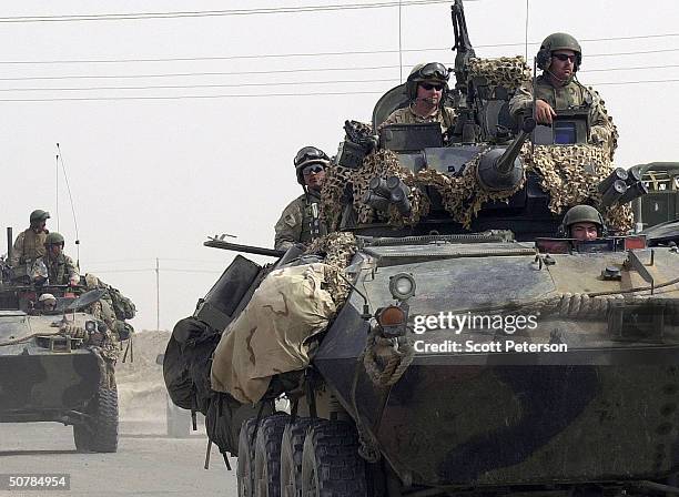 Marines maneuver in tanks on April 29, 2004 in Fallujah, Iraq. While U.S. Marine commanders hold peace talks, marines ready for battle at their base...