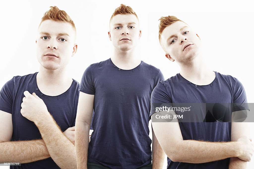 Three time multi exposure of young man staring