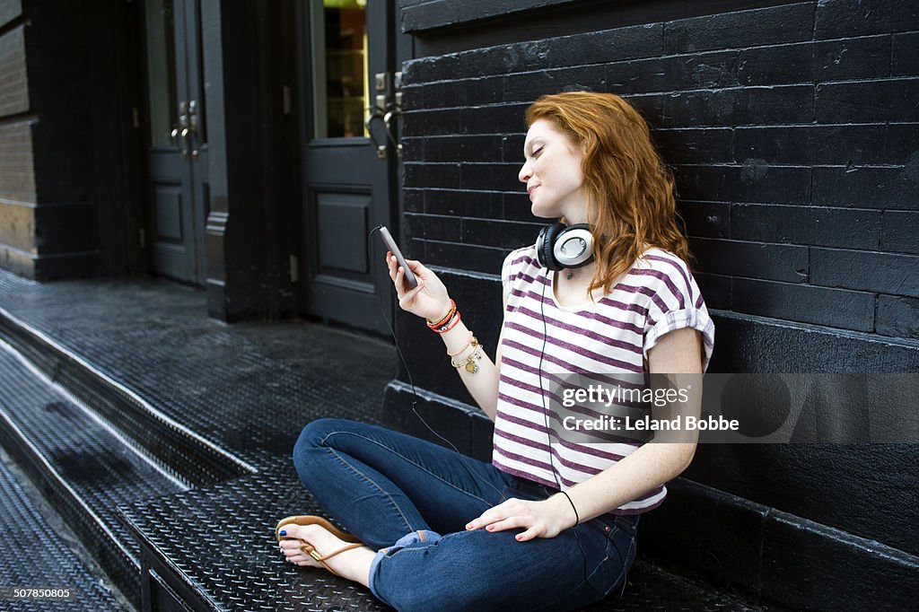 Portrait of young woman using mobile phone