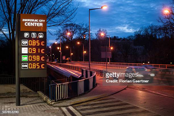 Car passes a petrol station just a few meters behind the border between Poland and Germany on January 31, 2016 in Zgorzelec. Many german people tank...