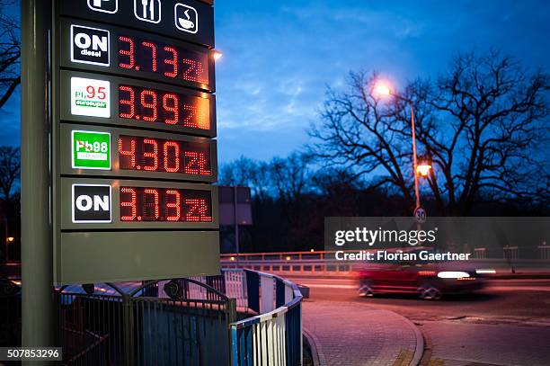 Car passes a petrol station just a few meters behind the border between Poland and Germany on January 31, 2016 in Zgorzelec. Many german people tank...