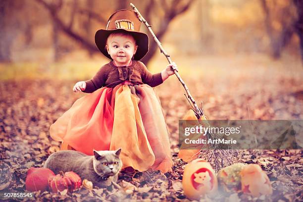 child celebrating halloween - halloween cats stockfoto's en -beelden