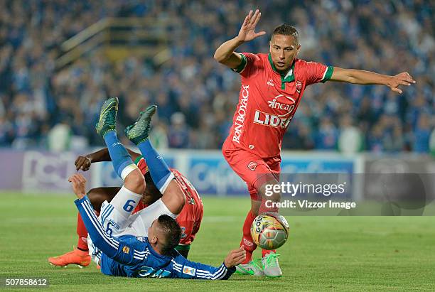 Michael Rangel of Millonarios fights for the ball with Anderson Zapata of Patriotas FC during a match between Millonarios and Patriotas FC as part of...