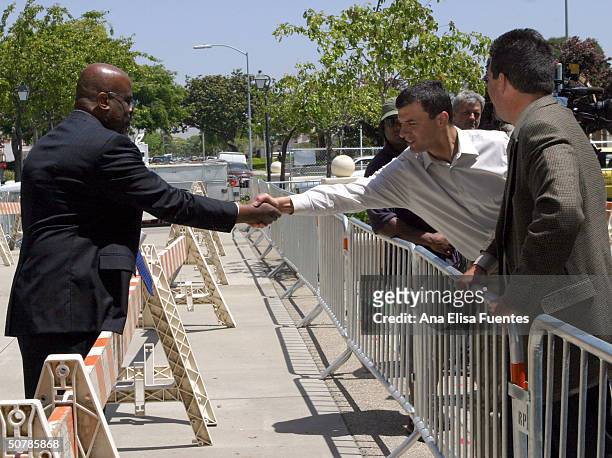 Leagal analyst Christopher Darden, and CNN correspondent Miguel Marquez, greet each other in front of the Superior Court of California County of...