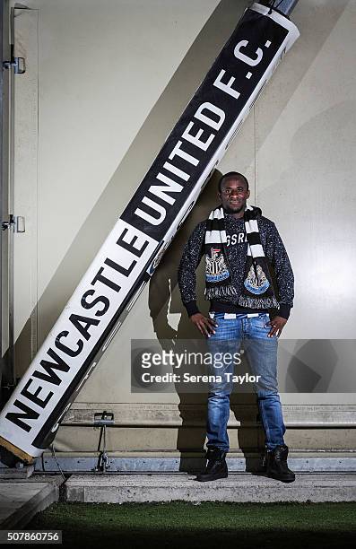 New loan Seydou Doumbia poses for photographs wearing a Newcastle Scarf with the Newcastle United sign in the indoor training tent at The Newcastle...