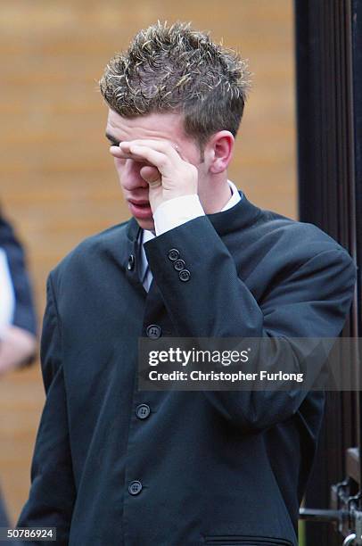 Grief stricken friends and family attend the funeral of murdered Scottish teenager Kriss Donald takes place at The Church Jesus Christ of Latter Day...