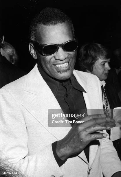 American singer, pianist and songwriter Ray Charles smiles at a reception given in his honor in the Empire Room of the Waldorf Astoria Hotel, New...