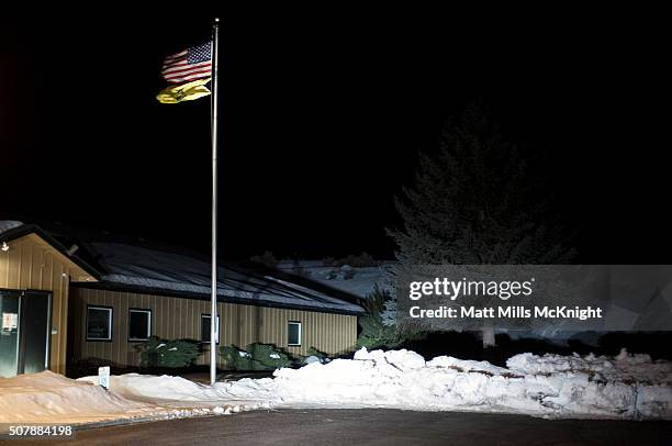 Gadsen flag waves under an American flag at the Bureau of Land Management Burns District Office January 31, 2016 outside Hines, Oregon. Eight...