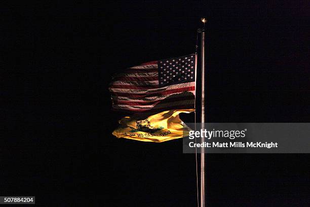 Gadsen flag waves under an American flag at the Bureau of Land Management Burns District Office January 31, 2016 outside Hines, Oregon. Eight...