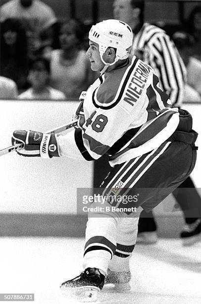 Scott Niedermayer of the New Jersey Devils skates on the ice during an NHL game circa 1991 at the Brendan Byrne Arena in East Rutherford, New Jersey.