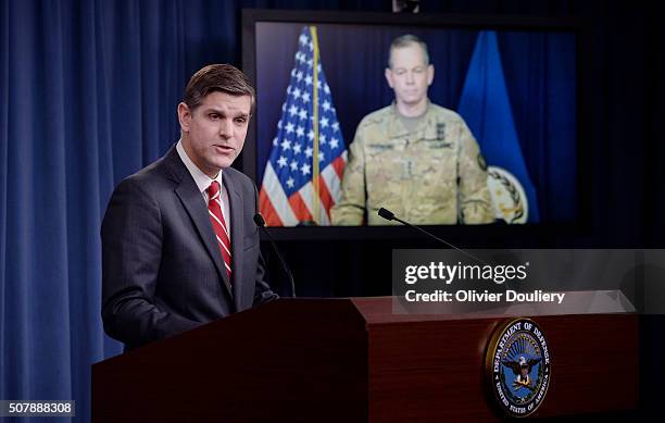Pentagon Press Secretary Peter Cook speaks as Combined Joint Task Force Commander Army Lt. Gen. Sean MacFarland listens via teleconference from...