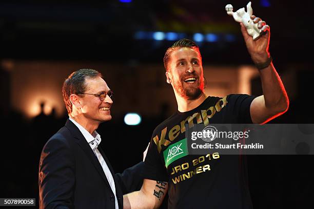 Michael Müller, burgermeister of Berlin presents a bear to Oliver Roggisch, team manager of Germany celebrate at the European Handball Champions...