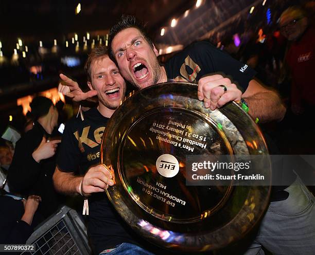 Stefen Weinhold and Carsten Lichtlein of Germany celebrate at the European Handball Champions winners party at Max Schmeling Halle on February 1,...