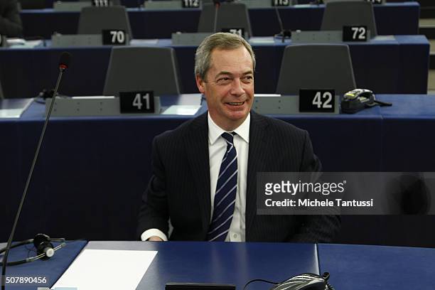 The leader of the British UKIP party Nigel Farage arrives in the plenary room in the European Parliament ahead of the debate on the ECB report for...