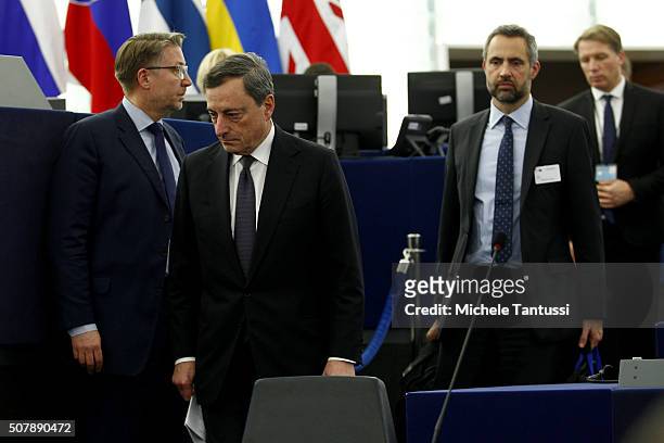 The governor of the European central Bank, or ECB Mario Draghi arrives in the plenary room in the European Parliament ahead of the debate on the ECB...