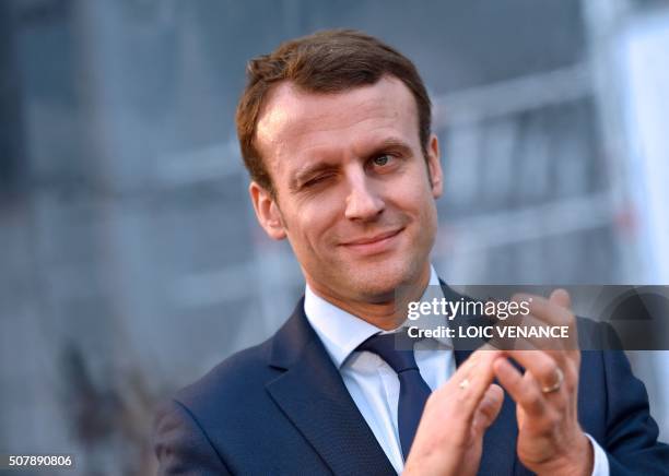 French Economy and Industry minister Emmanuel Macron applaudes during the MSC Meraviglia cruise ship coins ceremony, on February 1, 2016 in...