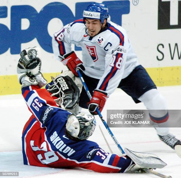 Slovakia's captain Miroslav Satan in a chance in front of Russian goalie Maxim Sokolov during the group F qualifing match in Ice Hockey World...