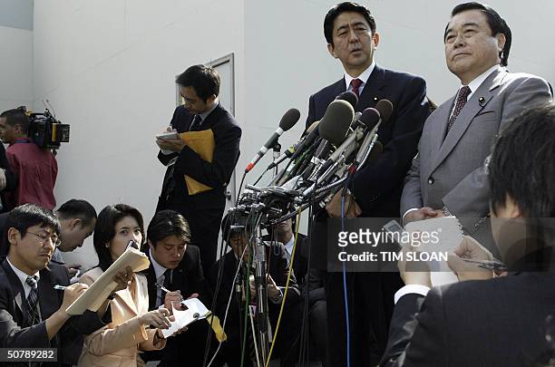 Shinzo Abe , secretary general of the ruling Liberal Democratic Party in Japan and Tetsuzo Fuyaohiba , secretary general of the New Komeito Party,...