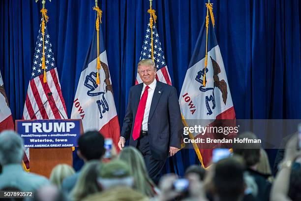 Republican presidential candidate Donald Trump arrives to speak at a campaign rally at the Ramada Waterloo Hotel and Convention Center on February 1,...