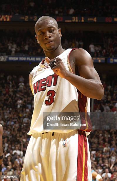 Dwyane Wade of the Miami Heat celebrates against the New Orleans Hornets in Game five of the Eastern Conference Quarterfinals during the 2004 NBA...