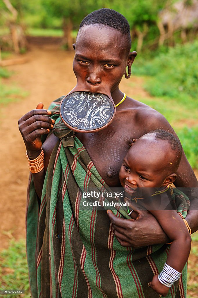 Portrait of woman from Mursi tribe, Ethiopia, Africa