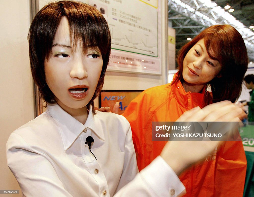A humanoid robot "Actroid", at 1.58-m in