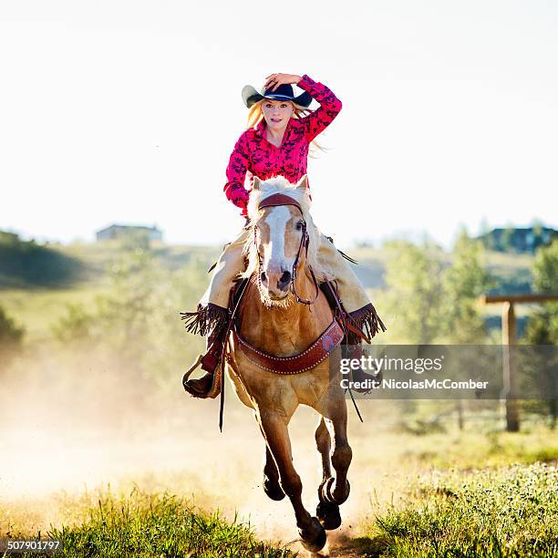 cowgirl auf fast - cowgirl stock-fotos und bilder