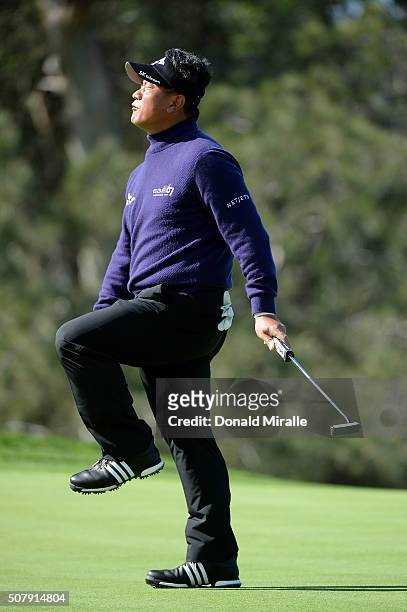 Choi of South Korea reacts after a missed putt on the 13th green during the final round of the Farmers Insurance Open at Torrey Pines South on...