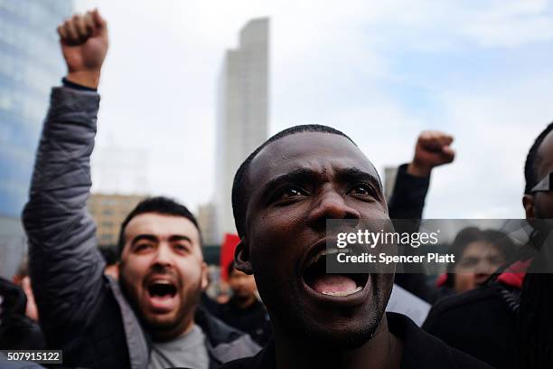 Uber drivers protest the company's recent fare cuts and go on strike in front of the car service's New York offices on February 1, 2016 in New York...