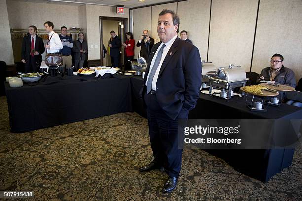 Chris Christie, governor of New Jersey and 2016 Republican presidential candidate, listens during his introduction at the Bull Moose Club luncheon in...