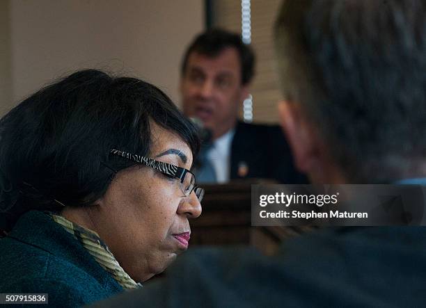 Candy Carson, the wife of Republican presidential candidate, Ben Carson listens to his competitor, New Jersey Gov. Chris Christie, during a luncheon...