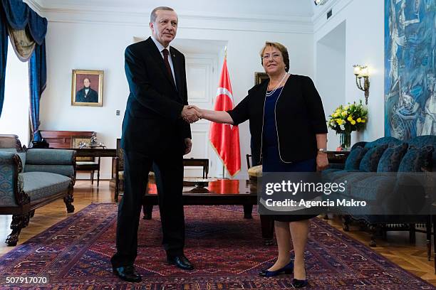 President of Chile Michelle Bachelet and President of Turkey Recep Tayyip Erdogan shake hands at Palacio de La Moneda on February 01, 2016 in...