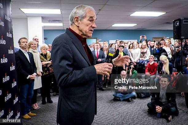 Former Congressman Ron Paul introduces his son, Senator Rand Paul during a caucus day rally at the Des Moines campaign headquarters on February 1,...