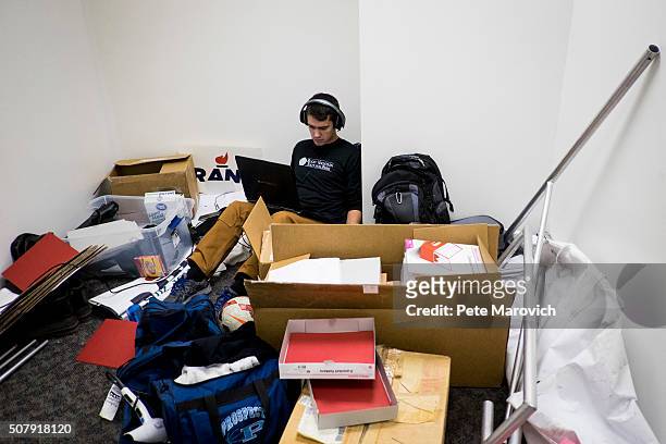 Rand Paul volunteer, Robert Kemper sits in an office that is being used as storage to make calls to potential voters at the Des Moines campaign...